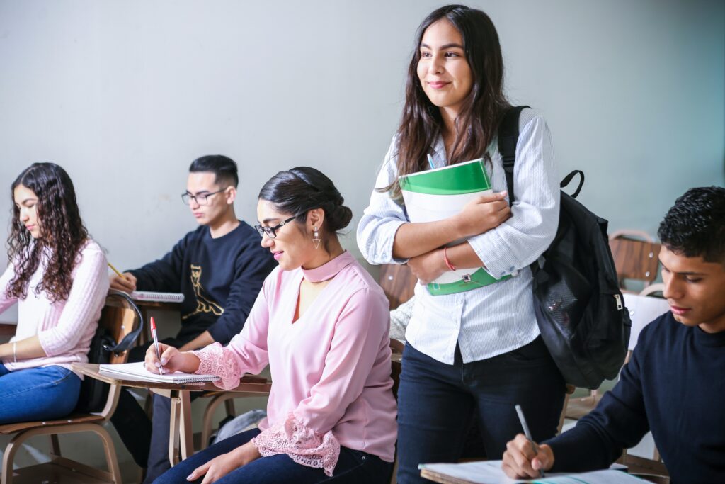 Group of college students inside their class studying