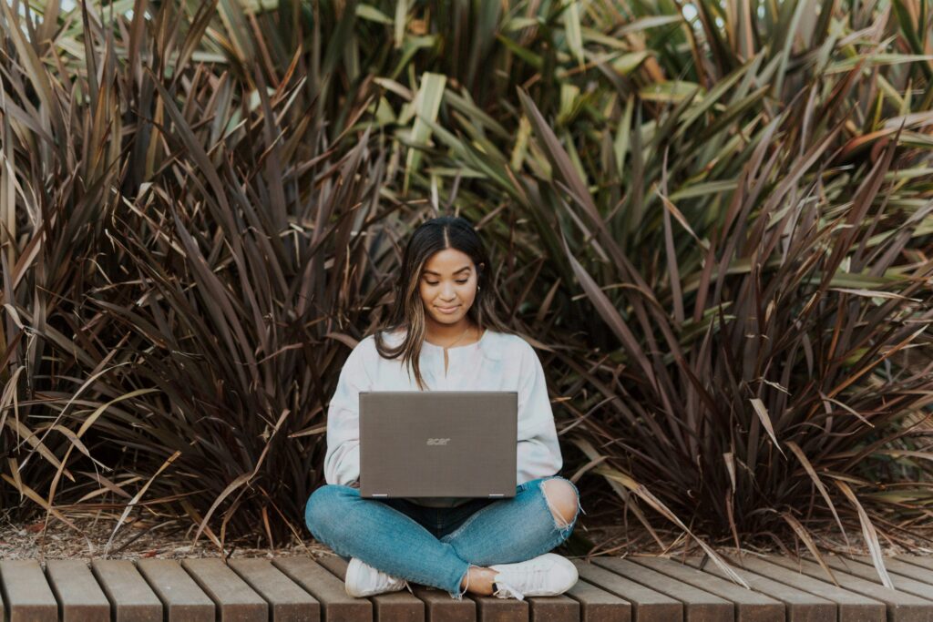 A female student researching with her laptop
