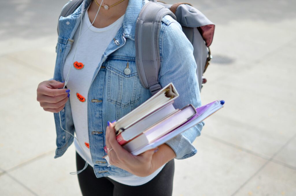 A female student carrying her books